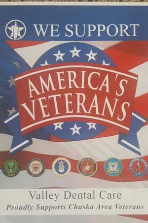 Photograph of a poster saying We Support America's Veterans