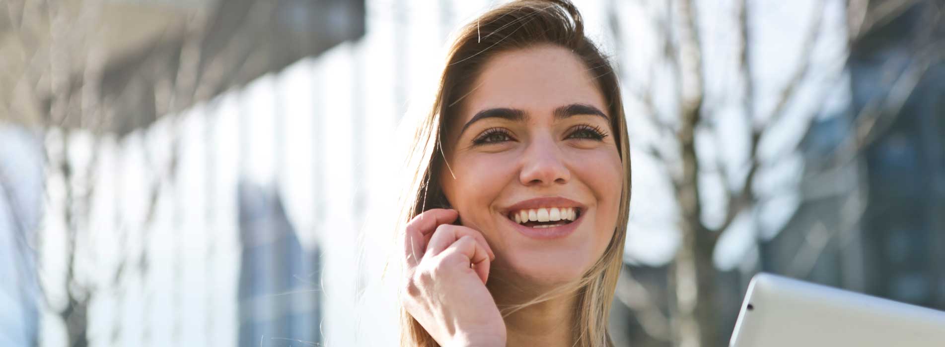 Woman Smiling While On Phone